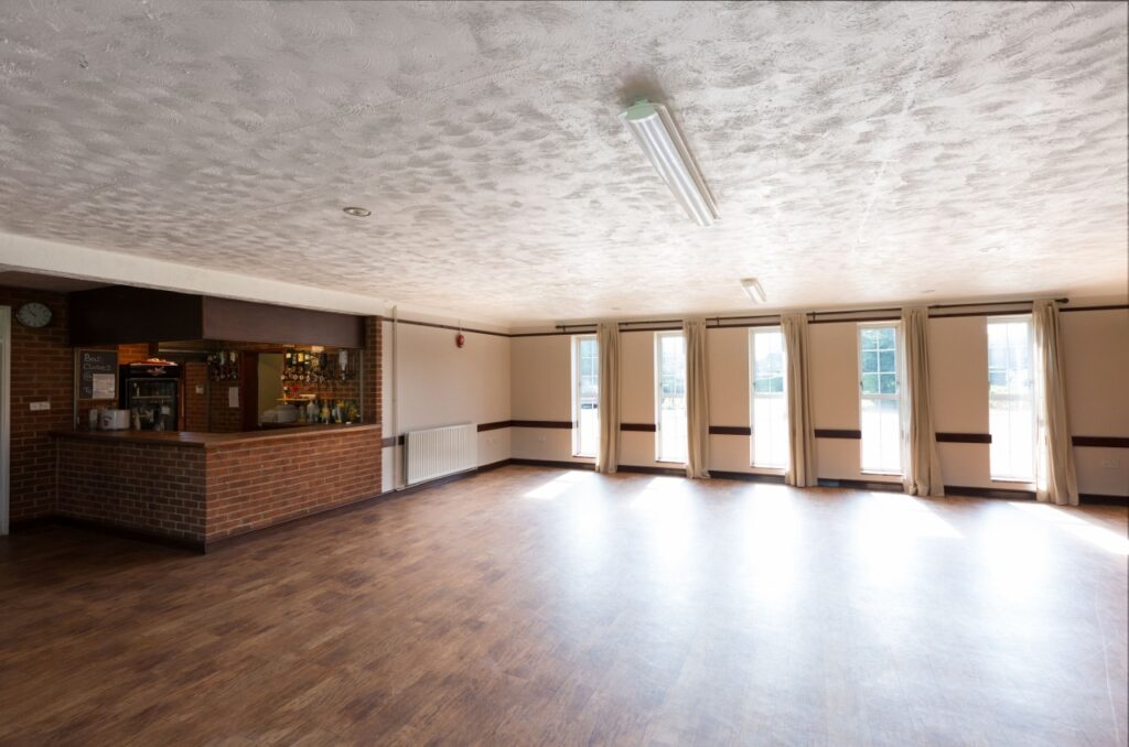 Interior view of hall looking towards the front windows